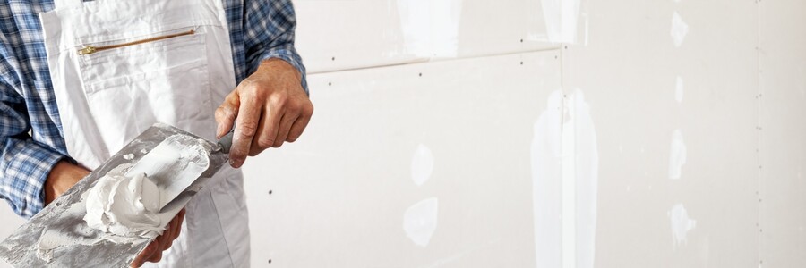 Drywall repair being performed by an experienced Zelaya Jr Painting drywall technician.